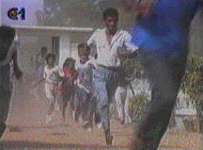Timorese flee Indonesian bullets at Santa Cruz Cemetery in Dili, 1991'